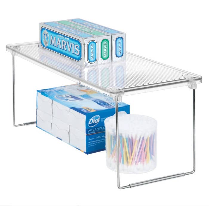 The stackable clear shelf with folding base