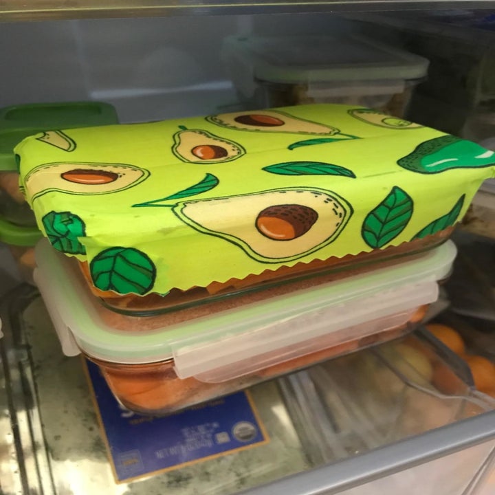 Reviewer photo of beeswax wrap on top of food storage container