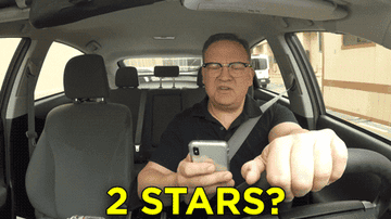 Andy Richter looks at his ratings while driving and says, &quot;Two stars? Talks too much? And no tip,&quot; on Conan