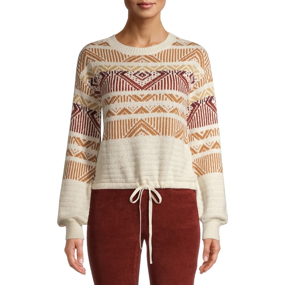 Model in fair isle tie string sweater in ivory and red