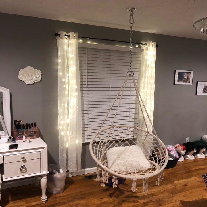 the crochet swing hanging in a bedroom