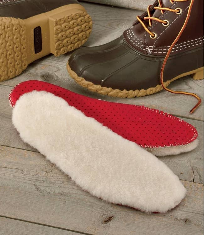 The natural shearling insoles which have a red bottom