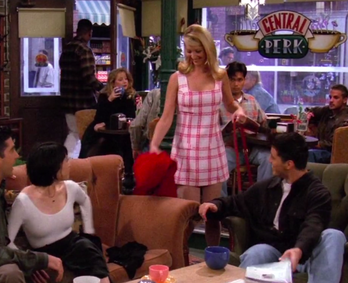 Phoebe wearing a plaid dress