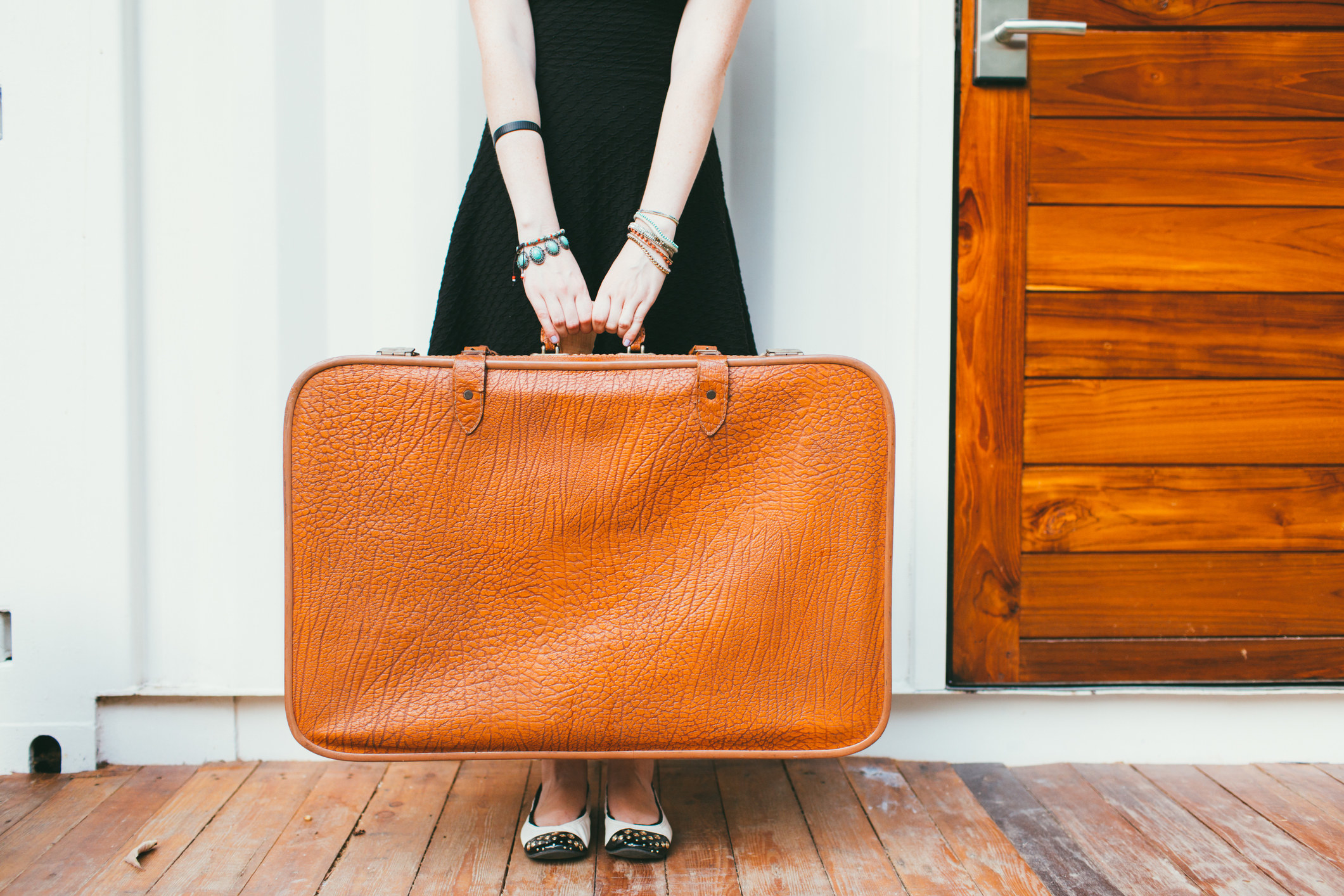  Woman holding a suitcase