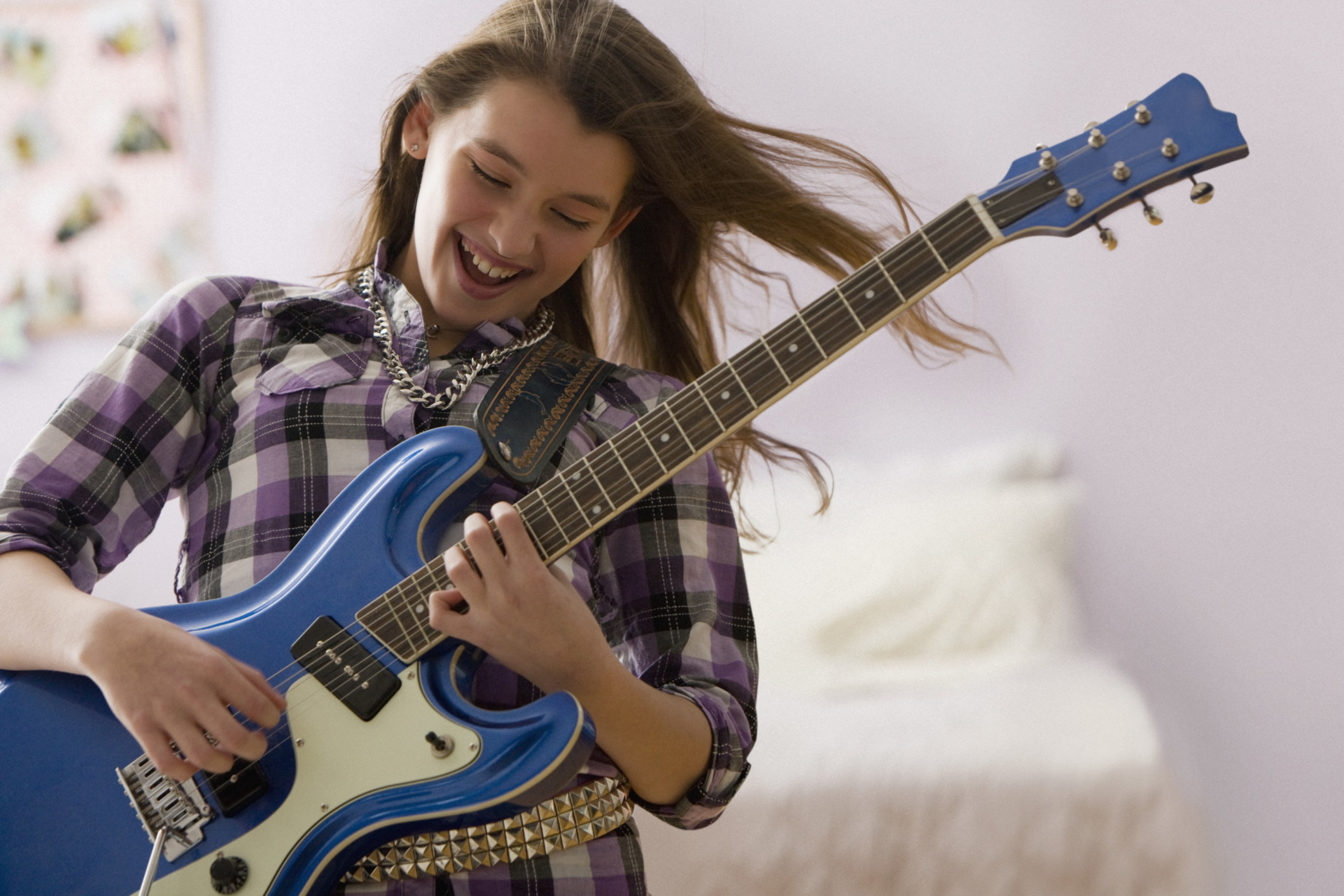 A girl playing guitar 