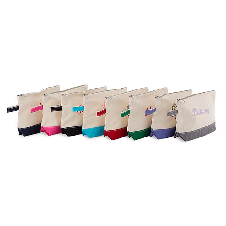plain canvas zipper toiletry bags with colorful bottoms and colorful embroidery