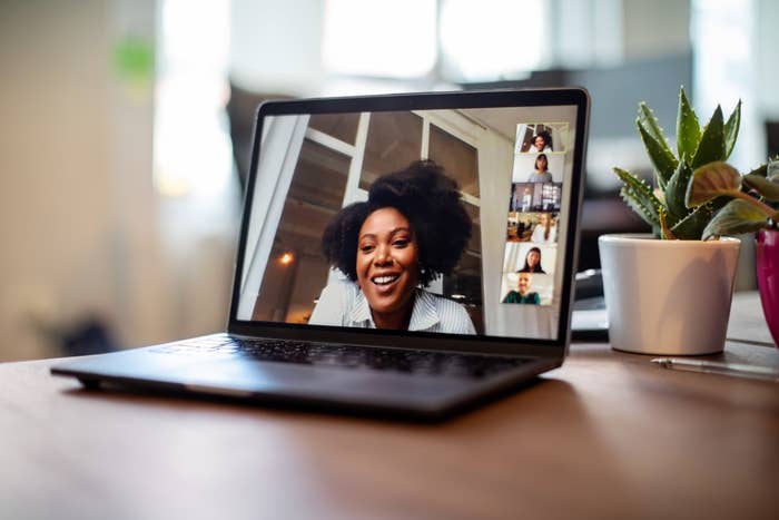 Businesswoman having a video call on a laptop with her team
