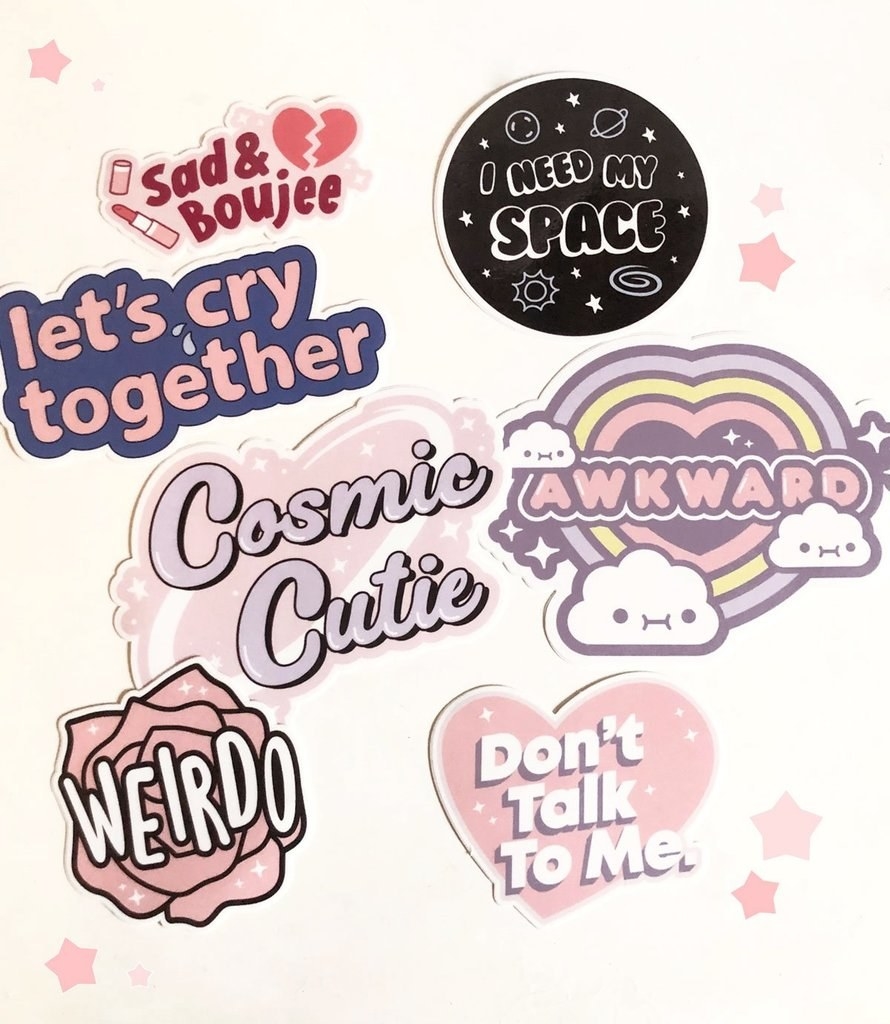 the sticker set with a rose sticker that says &quot;weirdo,&quot; an &quot;awkward&quot; sticker with cute clouds, an &quot;I need my space&quot; sticker and others
