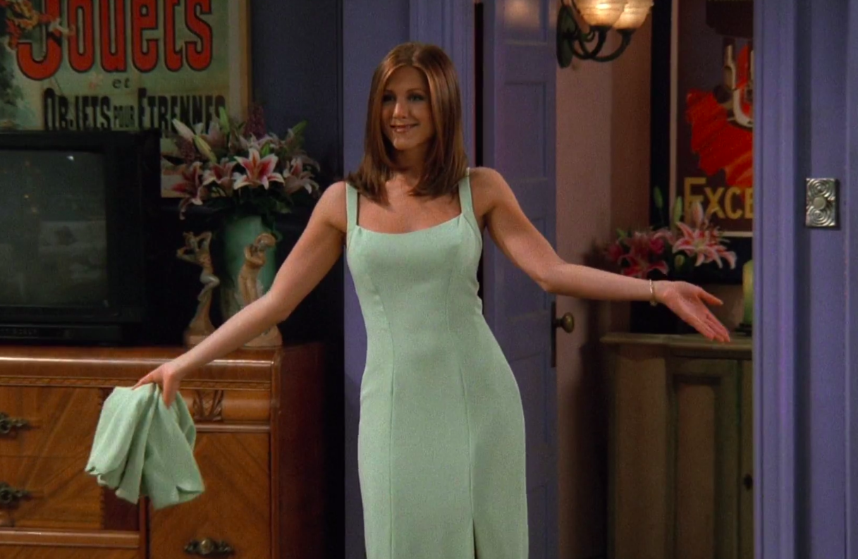 Rachel wearing a light gown with a slit