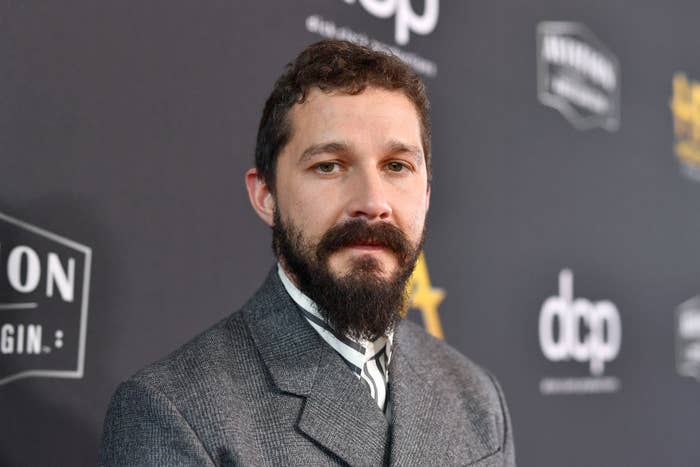 Shia LaBeouf wearing a suit on the red carpet