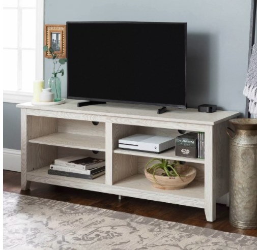 The weathered wood TV stand in the color white wash