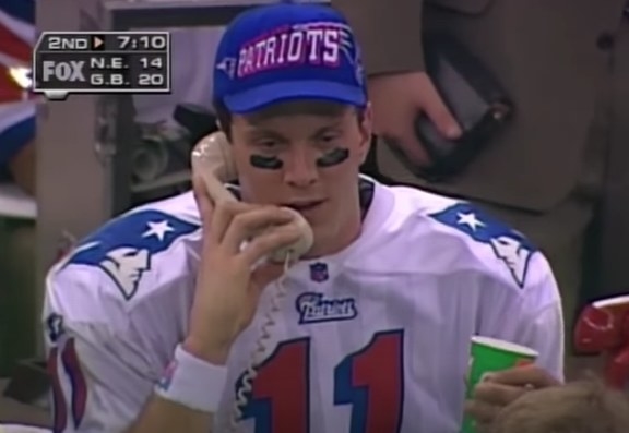 Drew Bledsoe on the phone on the sideline.