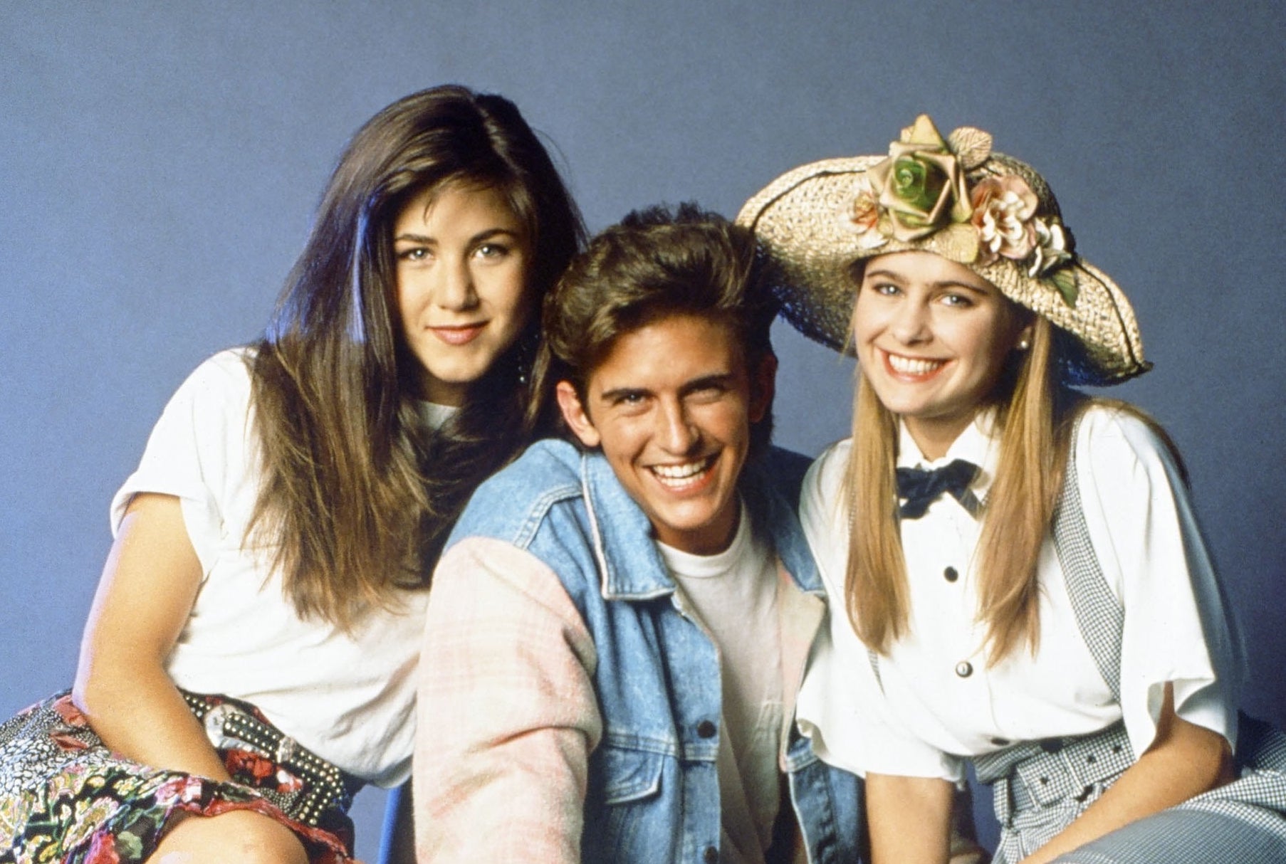 Jennifer Aniston as Jeannie Bueller, Charlie Schlatter as Ferris Bueller, Ami Dolenz as Sloan Peterson sitting on a white limo