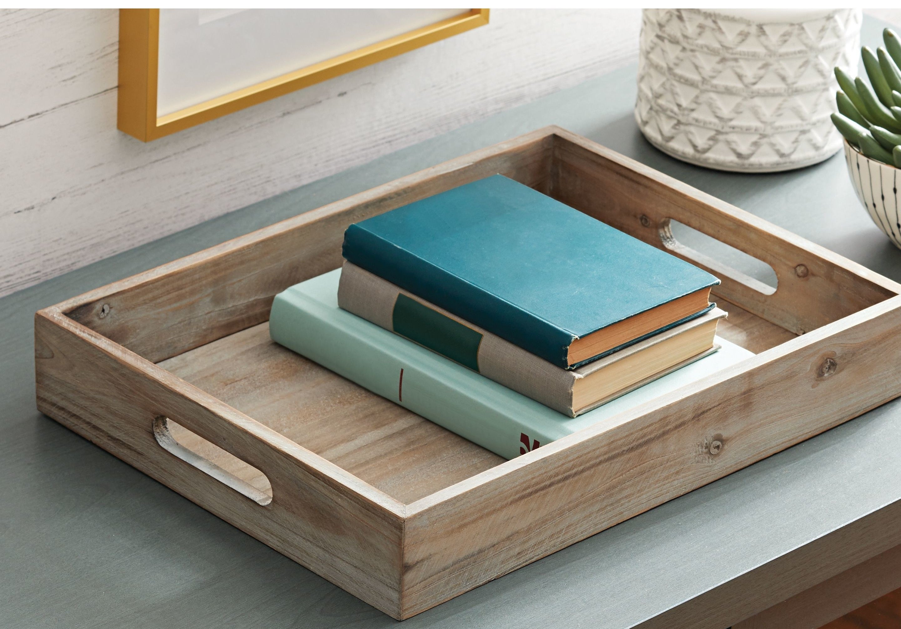 The tray, which is rectangular and has two oval cut-out handles