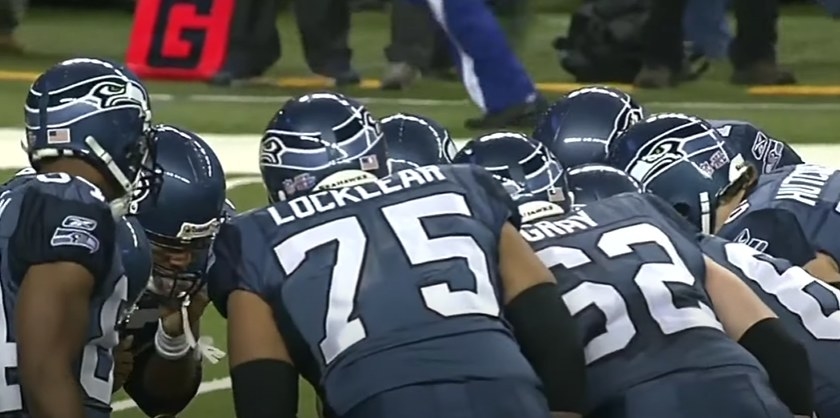 Seahawks offensive huddle.