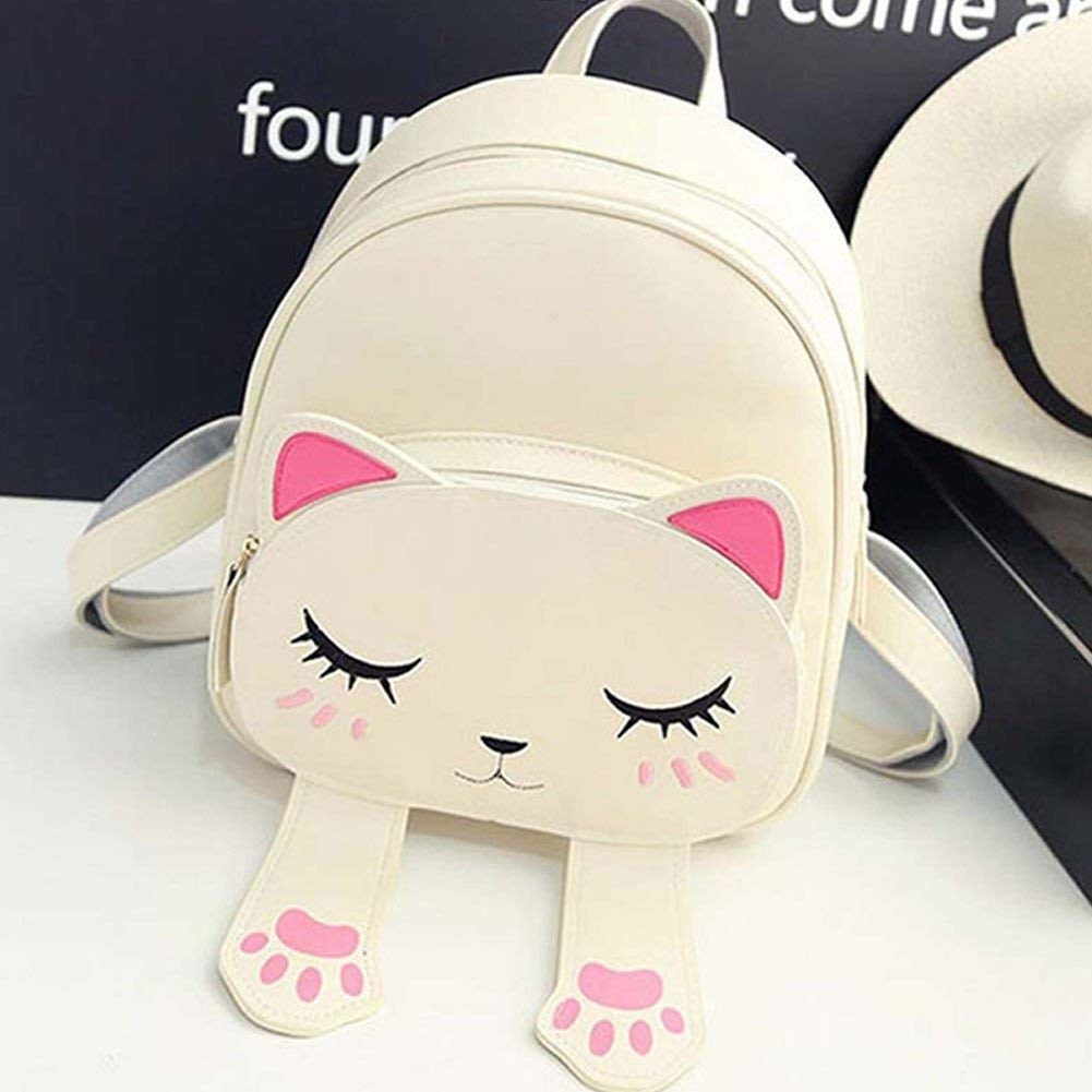 A pink and white cat bag 