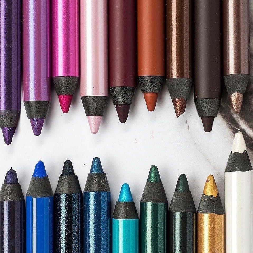 Eighteen chunky eyeliner pencils in two rows
