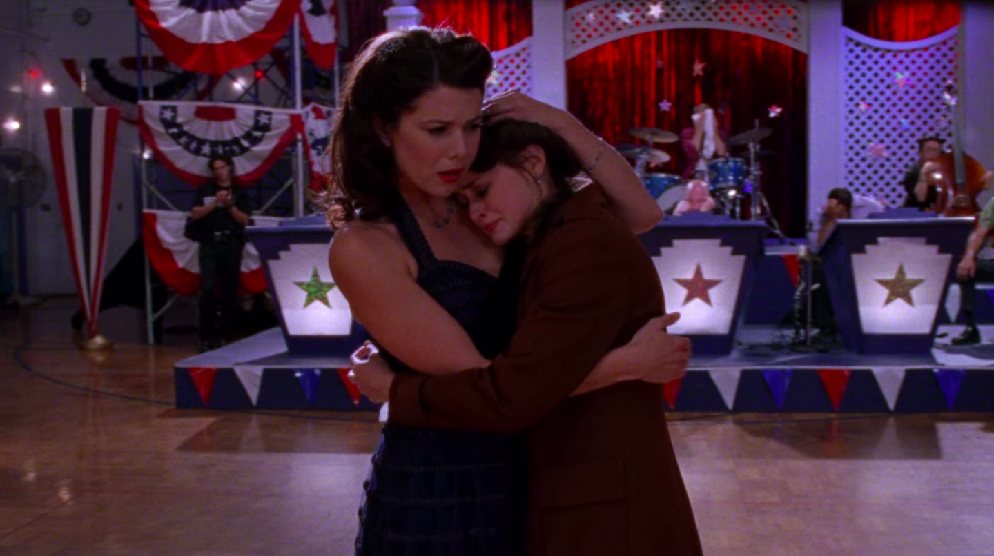 Lorelai hugging Rory while she cries.