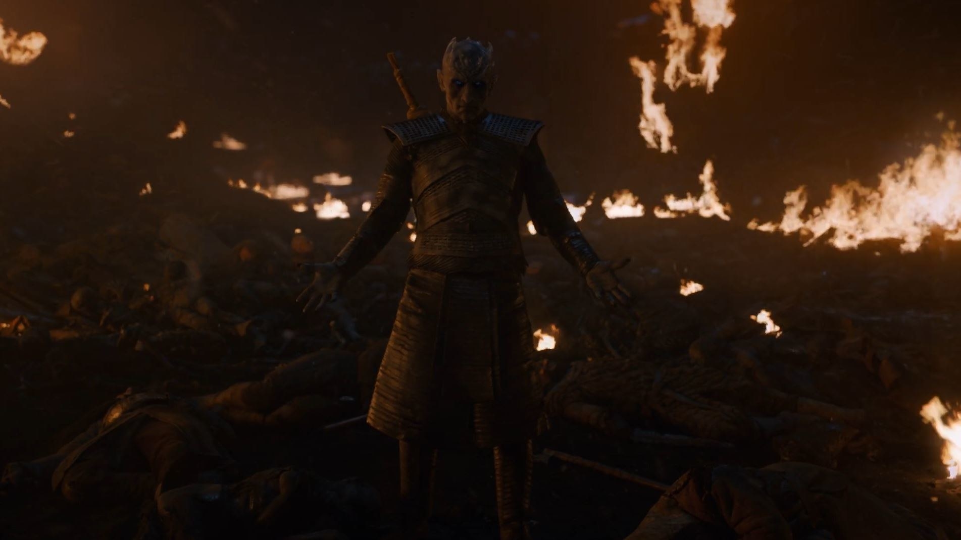 white walker king standing in front of fire
