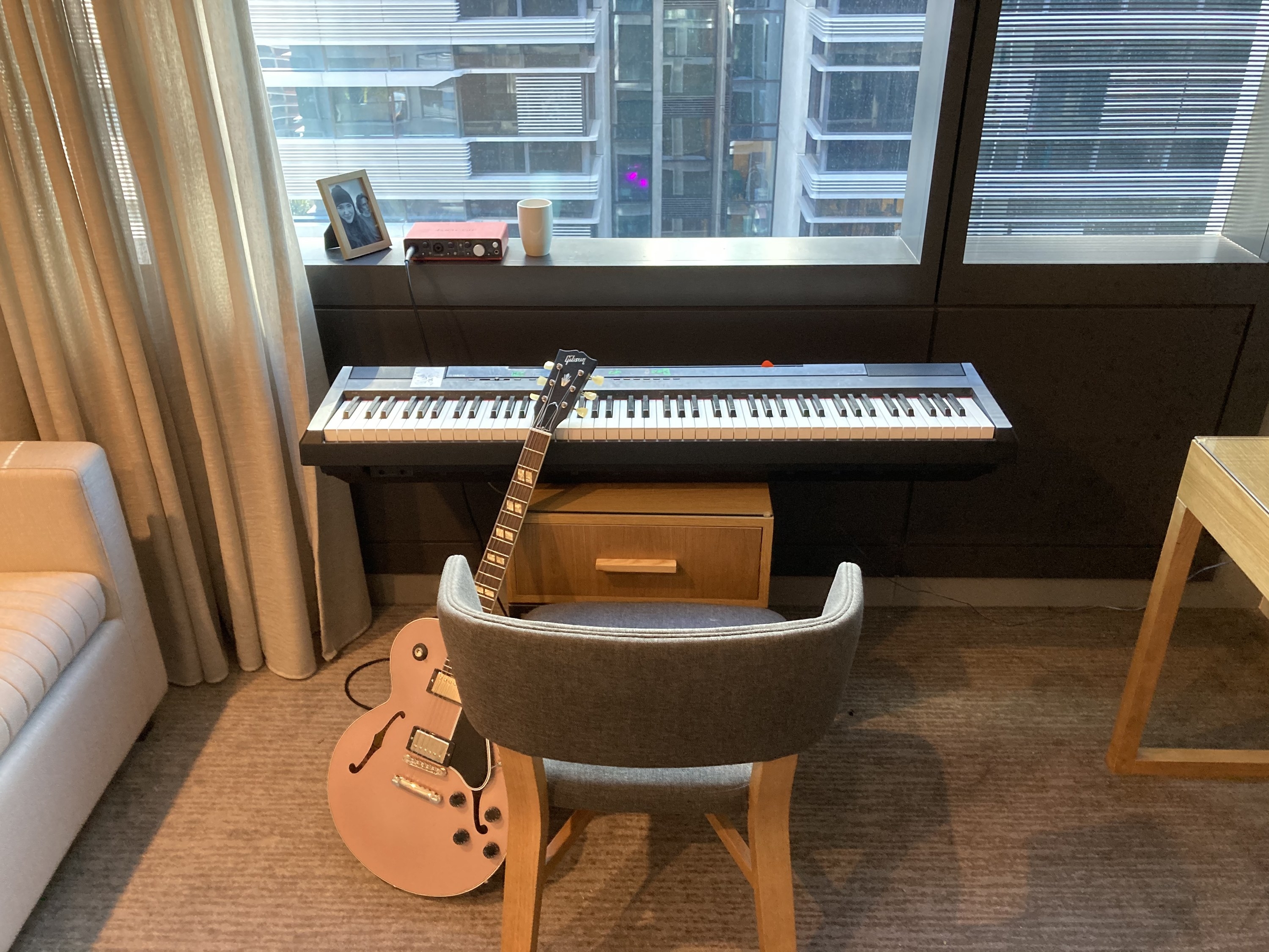 Stephen&#x27;s piano and guitar set up at near the window 