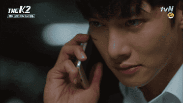 Ji Chang-wook smirks as he speaks on the phone