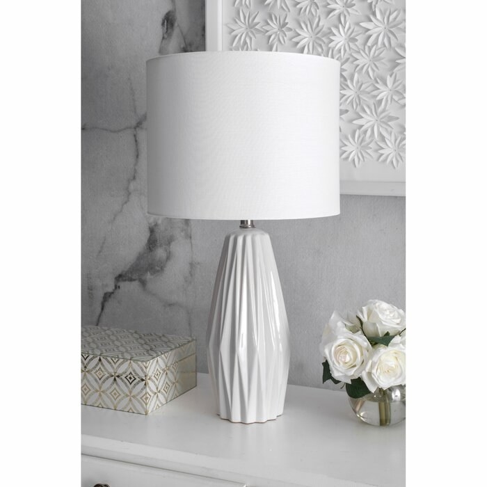 white lamp with structured base and white lamp shade