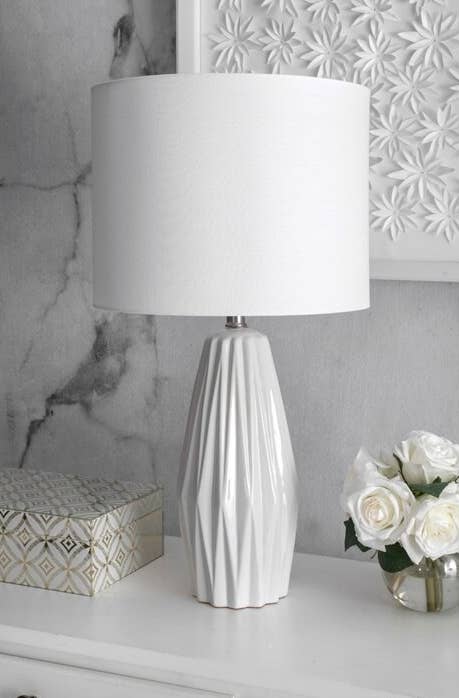 white lamp with structured base and white lamp shade