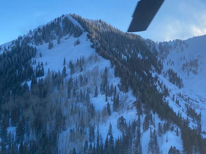 A snow covered mountain seen from a helicopter
