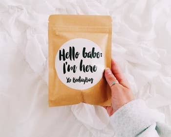 A hand holding a BootayBag delivery