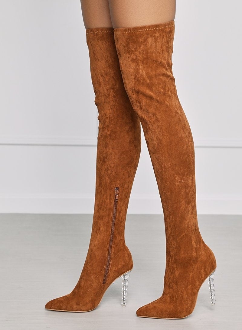 The tan suede boots with clear ball drop pedestal heel