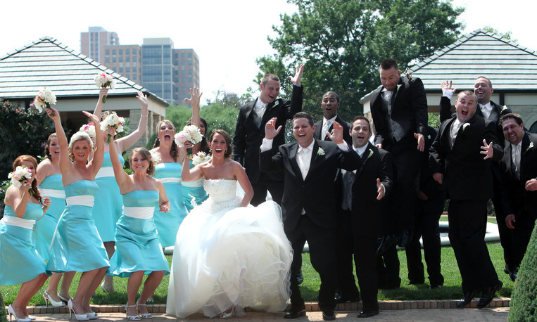 A large wedding party with tons of bridesmaids and groomsmen