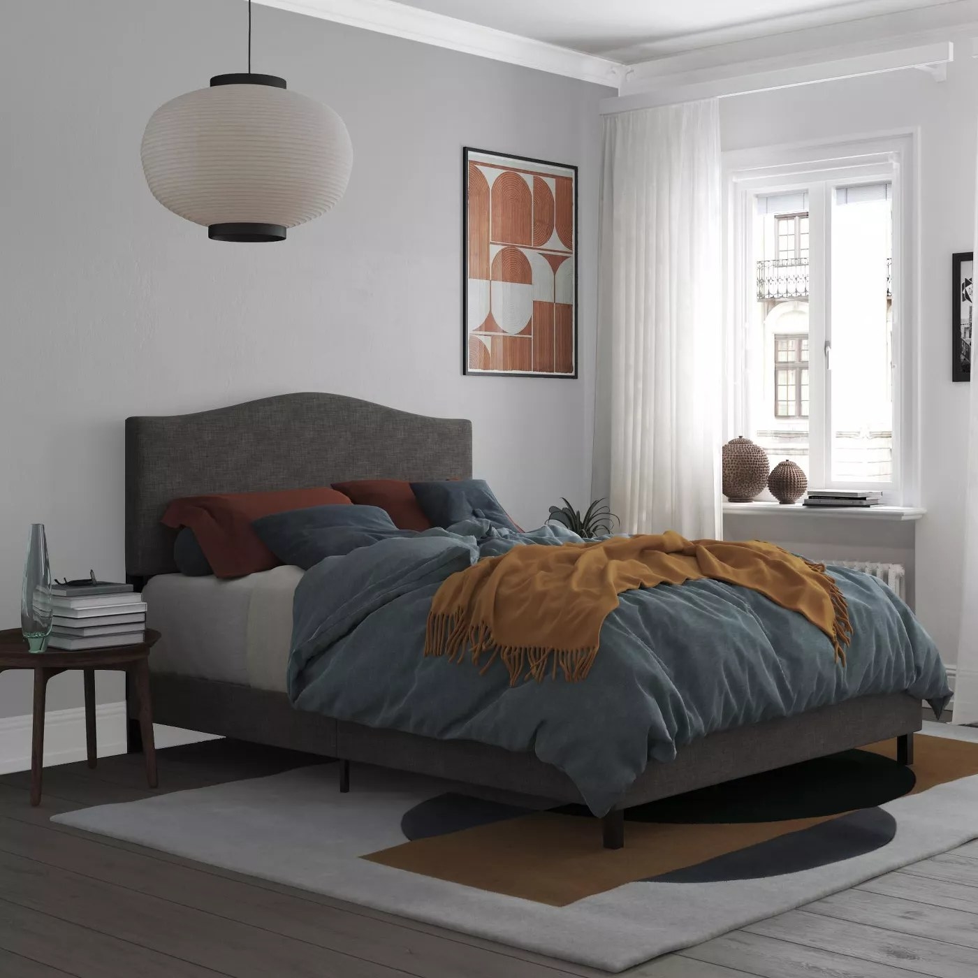 The gray, upholstered bed frame