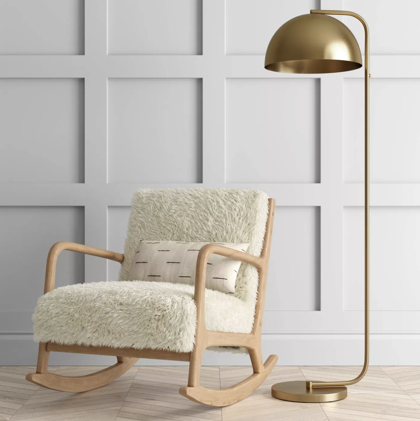 A brass floor lamp next to a chair