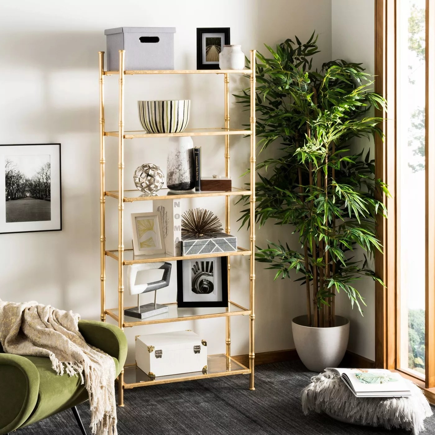 The gold and glass shelving unit