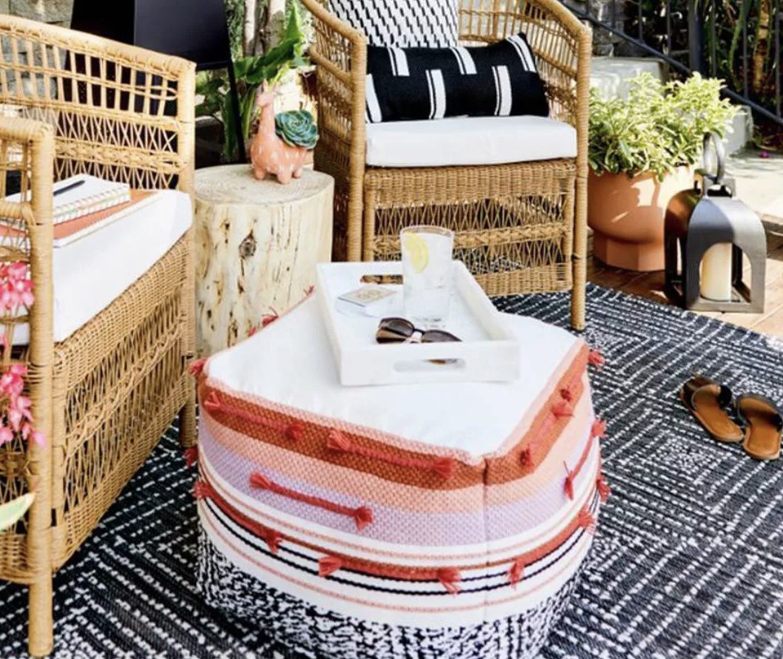 A marble tray on a pouf
