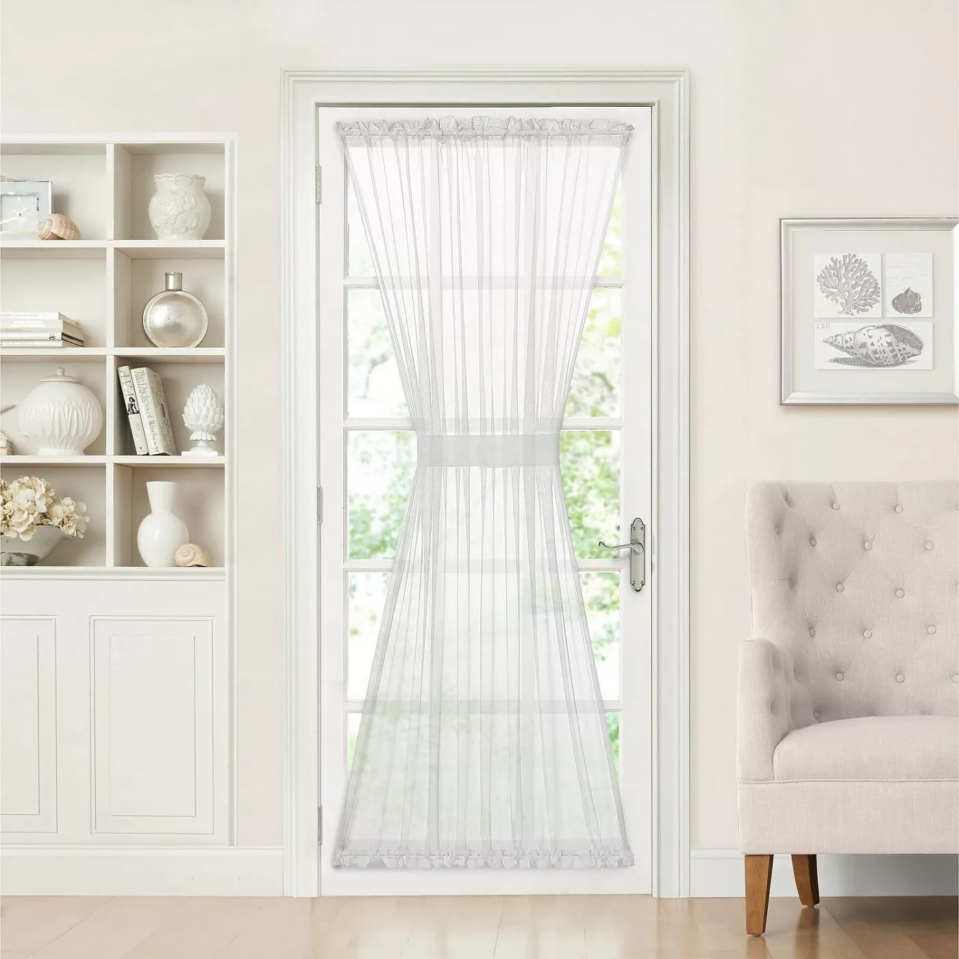 The white curtain panel with a tie-back band