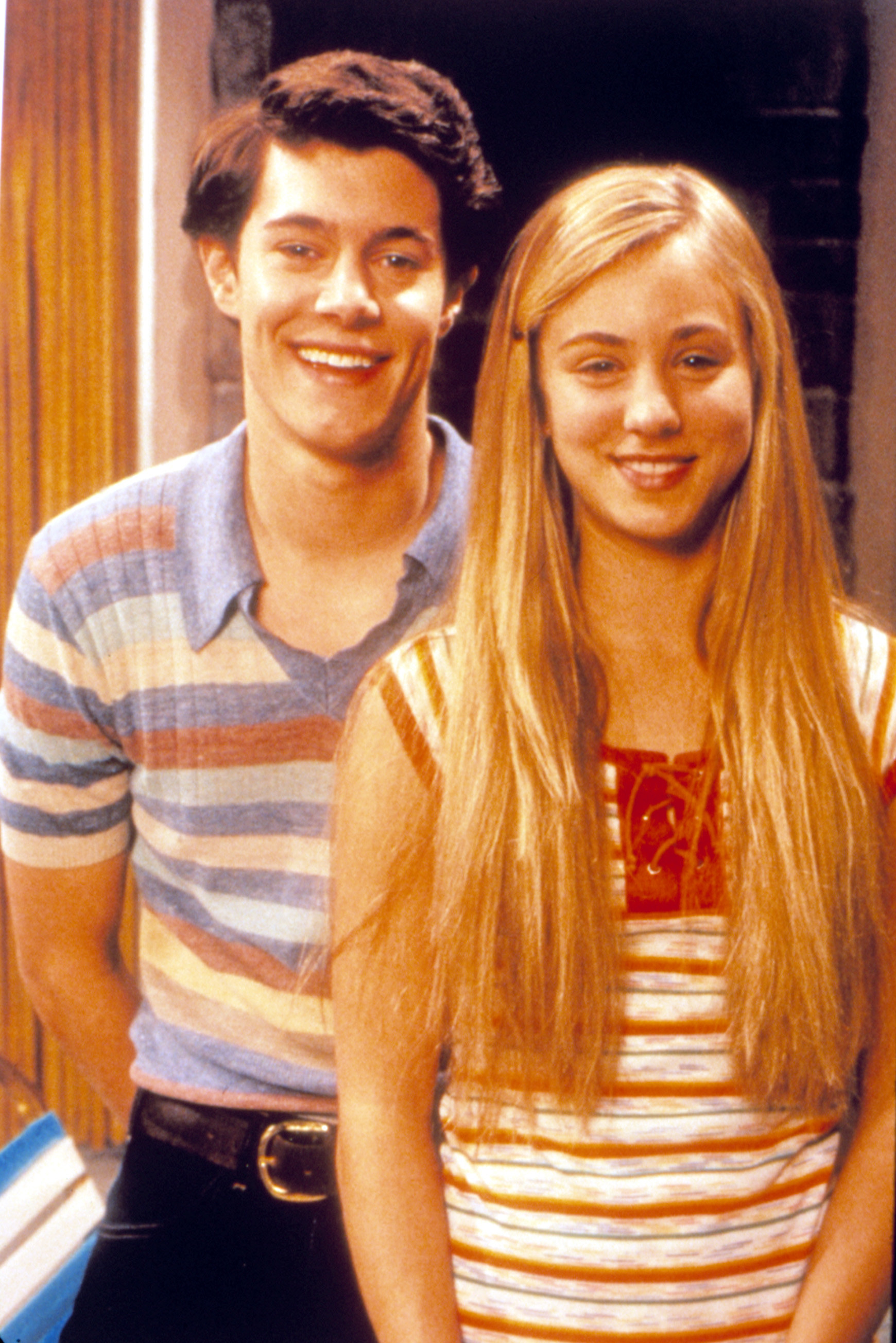 A photo of Adam Brody and Kaley Cuoco dressed up as Greg and Marcia Brady