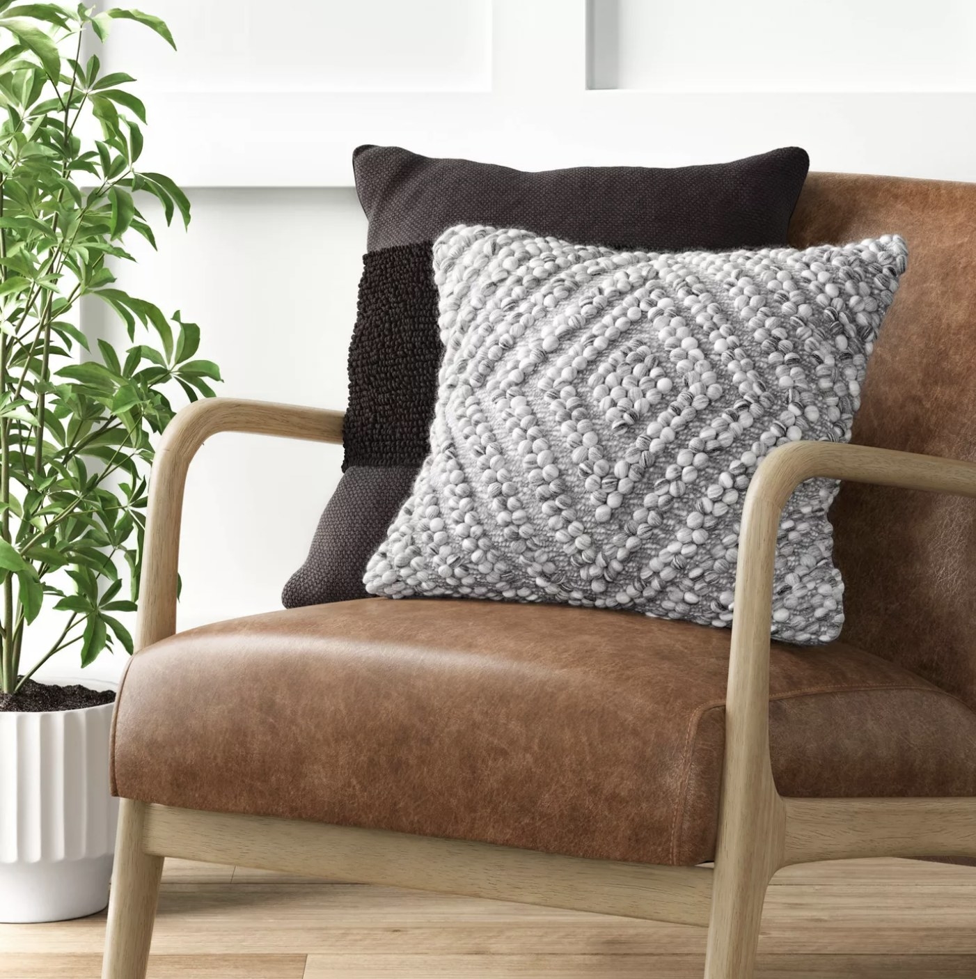 Diamond patterned throw pillow on a chair