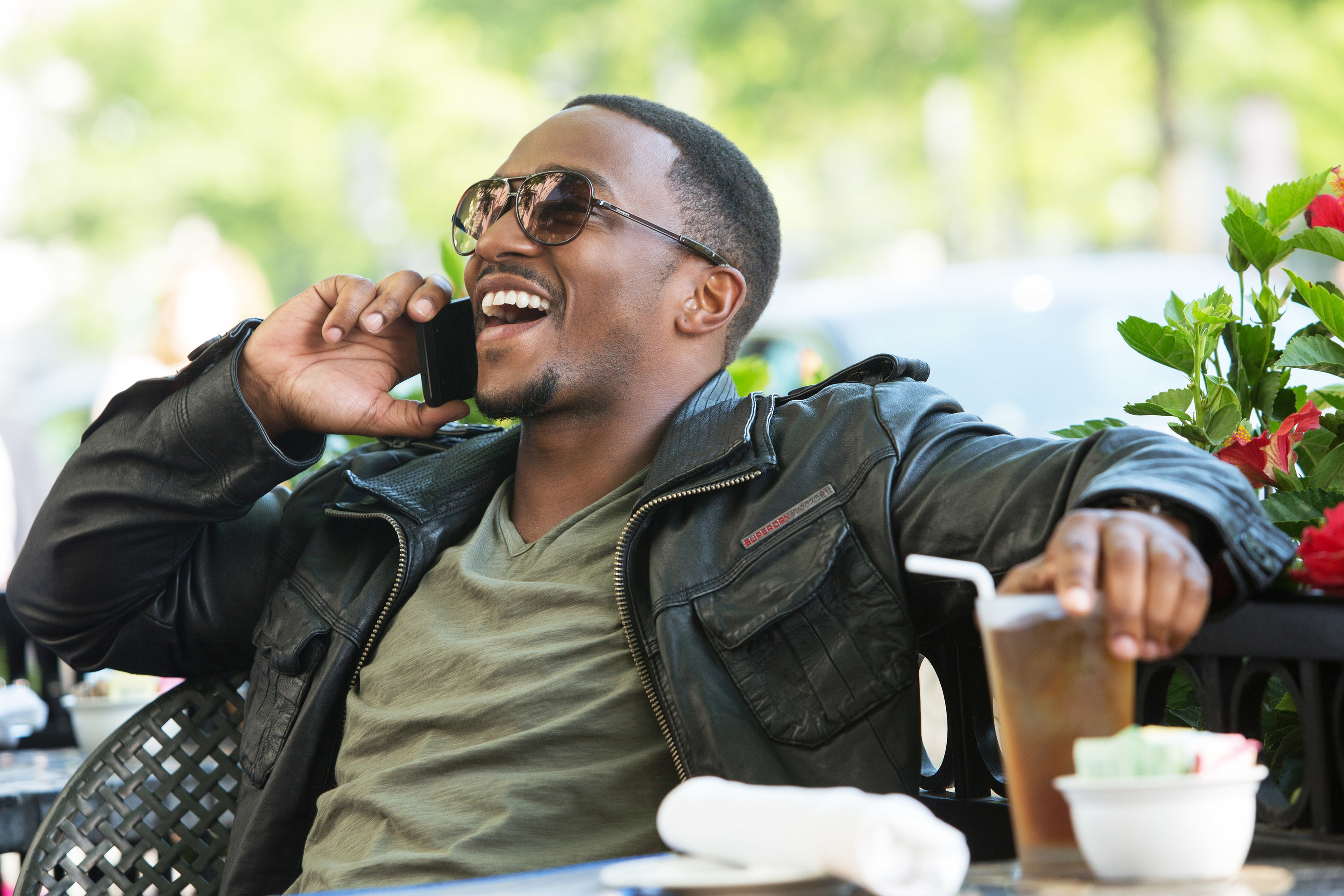 Anthony Mackie laughs while on the phone in Captain America: The Winter Soldier