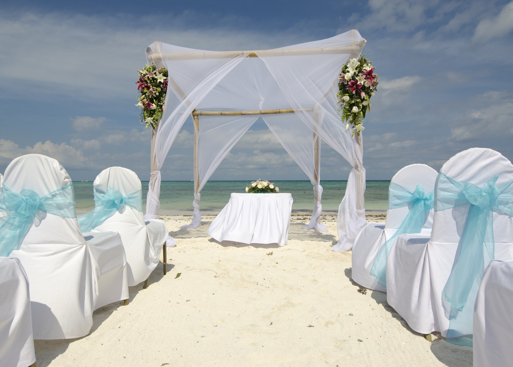 A classic beach wedding with white decor