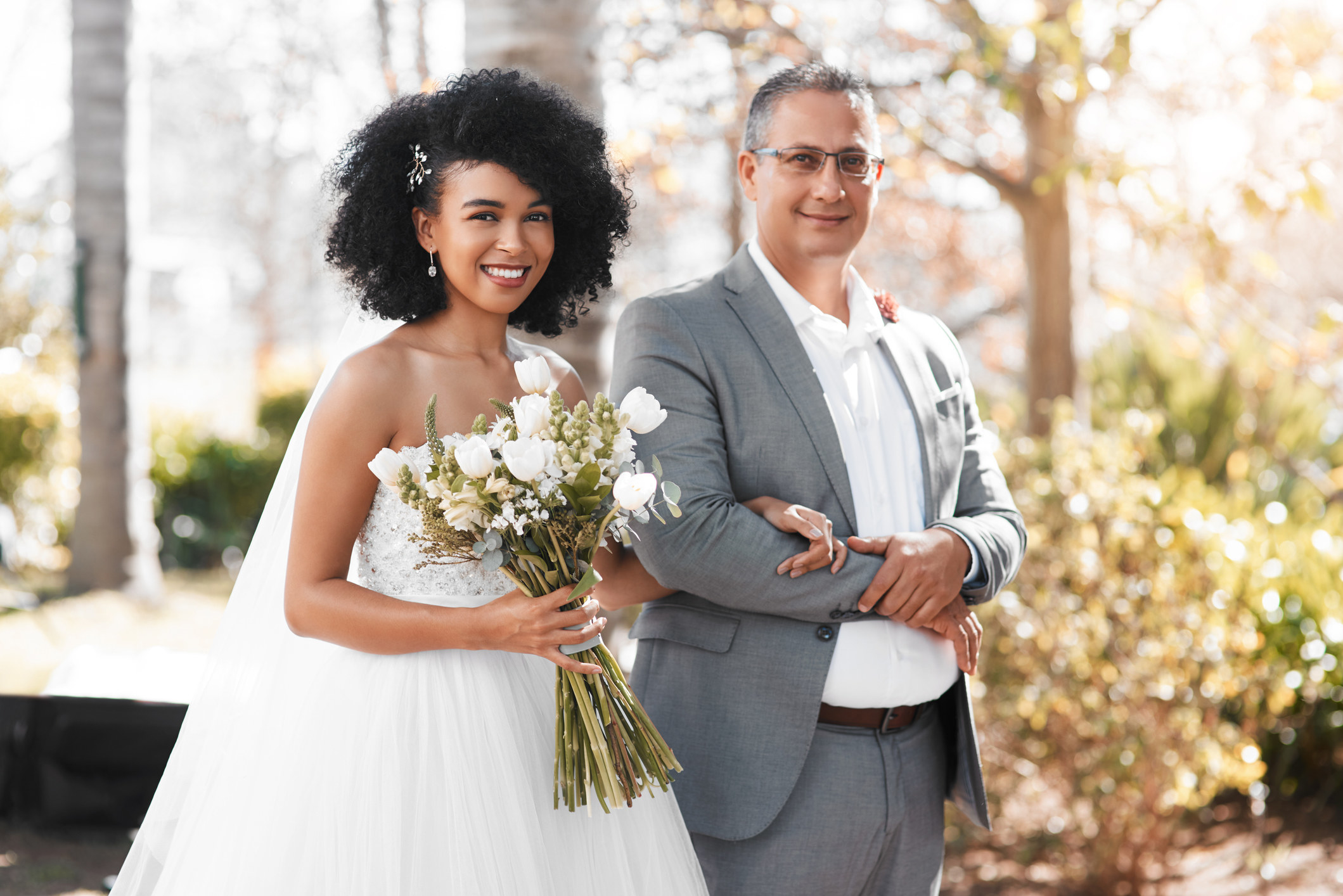 A bride and father walk down the aisle