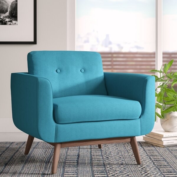 The fabric armchair in teal