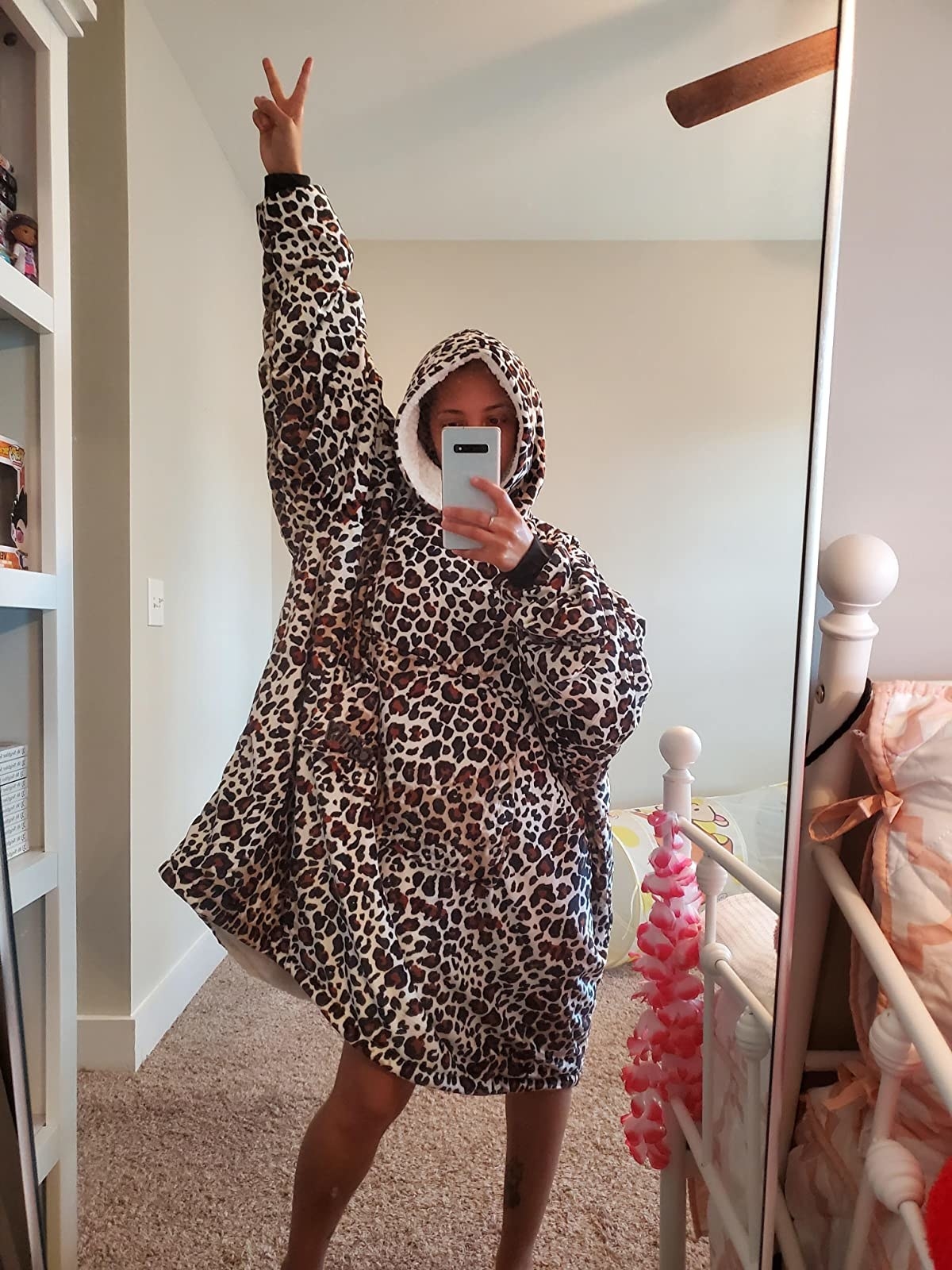 reviewer wearing leopard print blanket