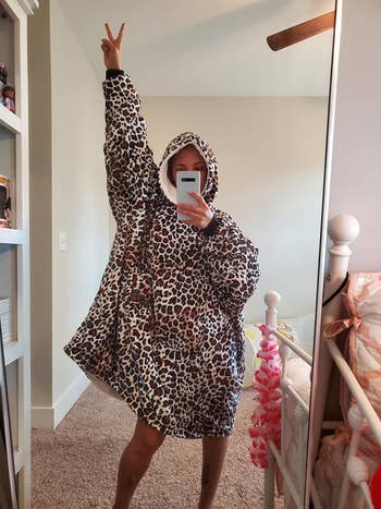 reviewer wearing leopard print blanket