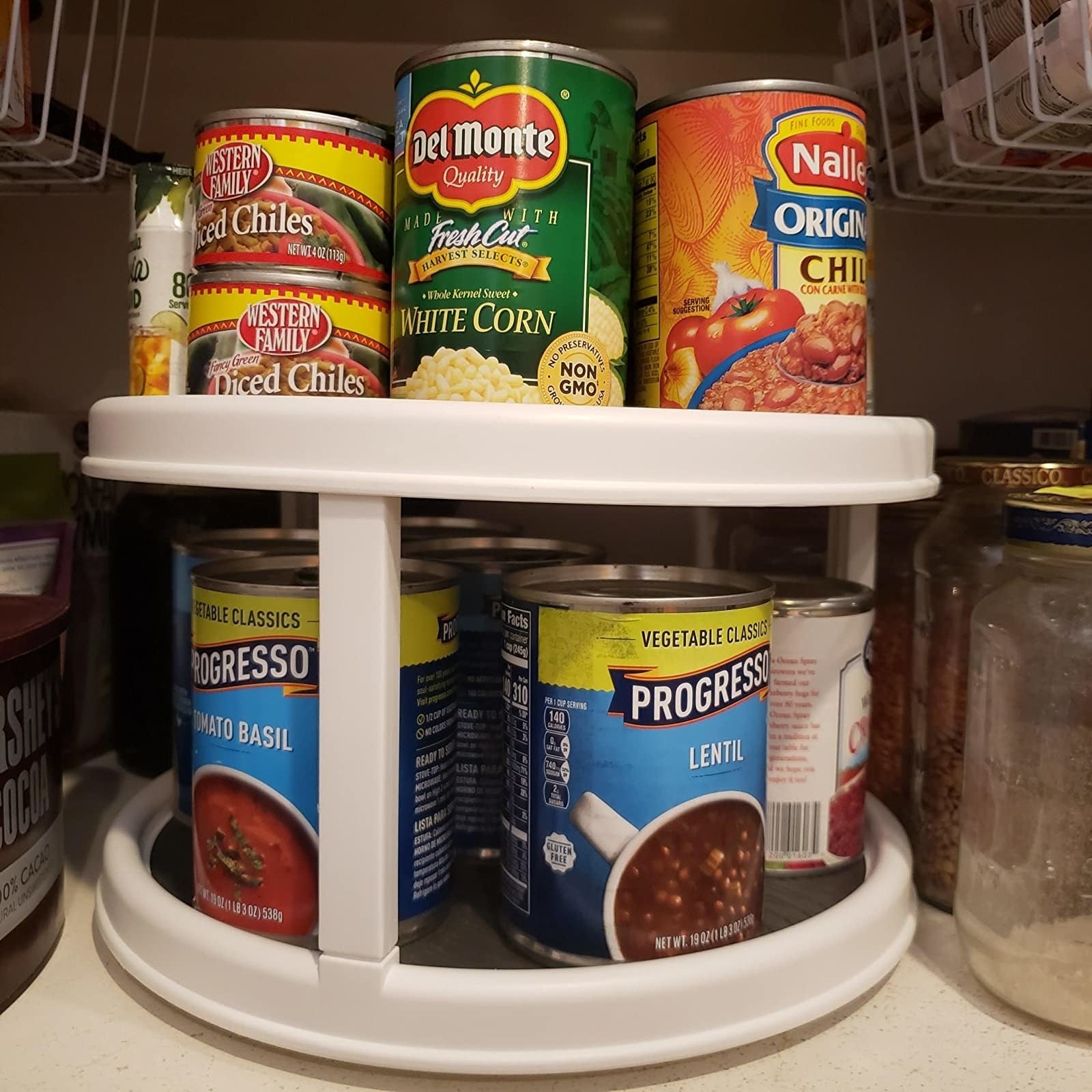 A reviewer's photo of the lazy Susan holding soup cans