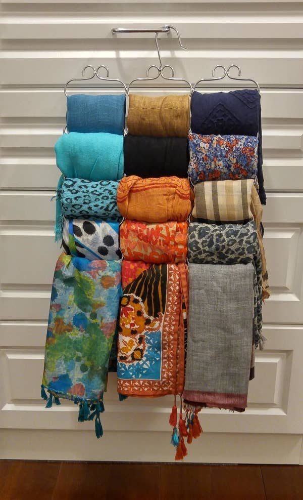A reviewer's photo of the organizer holding 15 scarves