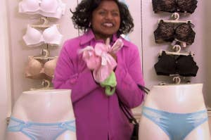 kelly kapour from the office in victoria's secret jumping out and down with her hands full of panties