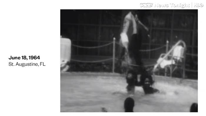 A screenshot of the video, showing swimming pool protesters at the Monson Motor Lodge in St. Augustine, Florida scream as motel manager James Brock dumps chemicals into the pool