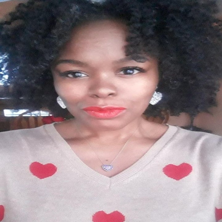 Reviewer's closeup of the tan and red heart patterned sweater 