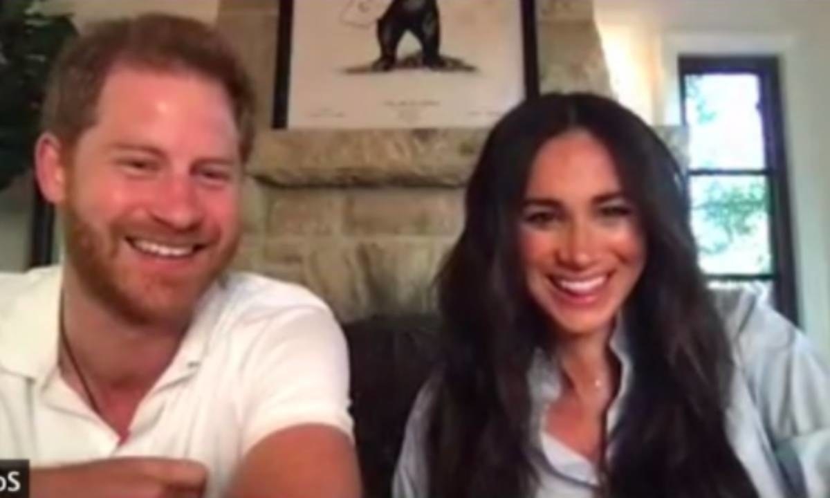 Meghan and Harry smile during the Zoom